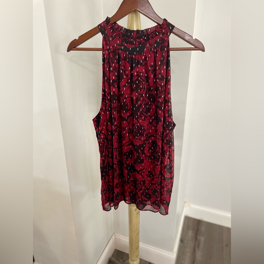 Red and black sleeveless blouse.